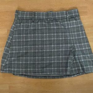 A Plaid Skirt. Has a stretchy waistband. Skirt goes slightly above the knees.